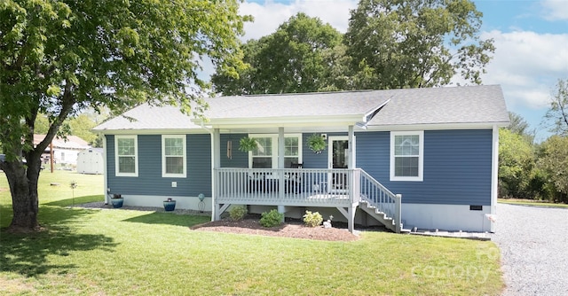 413 London St, Morganton, NC 28655 - view of front facade featuring roof with shingles, a porch, and a front lawn