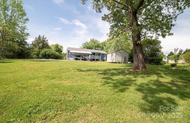 413 London St, Morganton, NC 28655 - view of yard with a carport and an outdoor structure