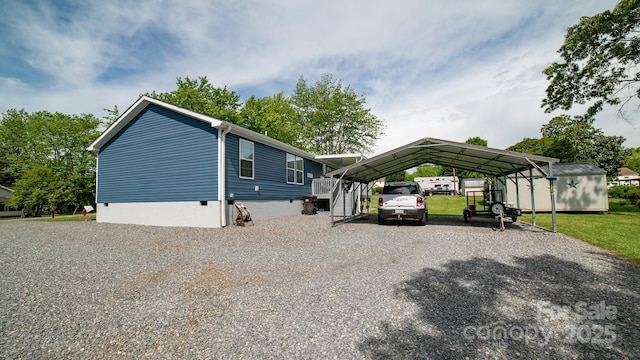413 London St, Morganton, NC 28655 - view of front of house with crawl space, a front yard, a detached carport, and gravel driveway