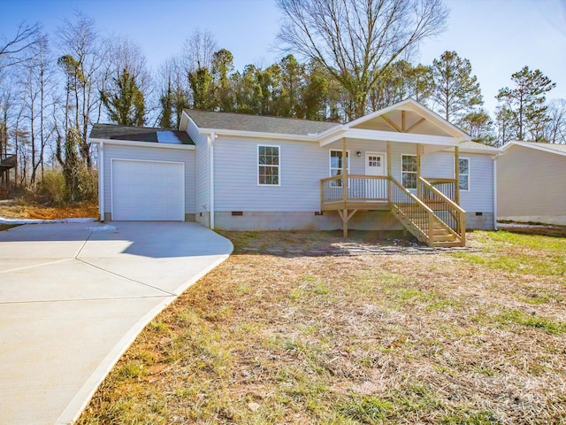 ranch-style home with a garage and a porch