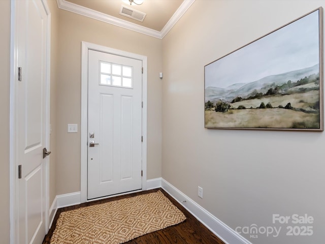 foyer with ornamental molding and hardwood / wood-style floors