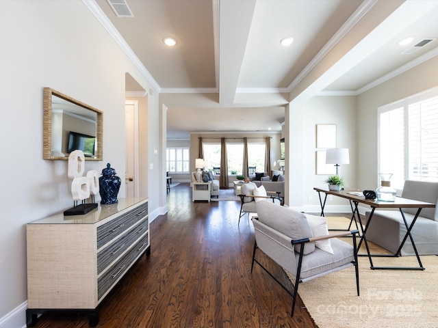 interior space featuring beamed ceiling, ornamental molding, and dark hardwood / wood-style flooring