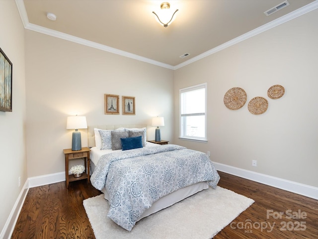 bedroom with crown molding and dark hardwood / wood-style flooring