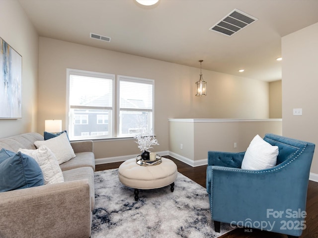 living room featuring dark hardwood / wood-style flooring