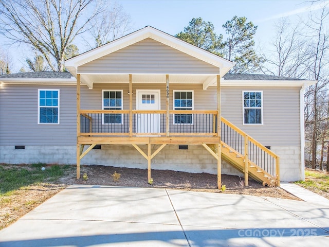 rear view of house with covered porch