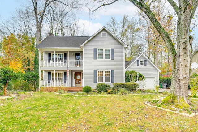 view of front facade featuring a porch, a balcony, a front lawn, and a garage