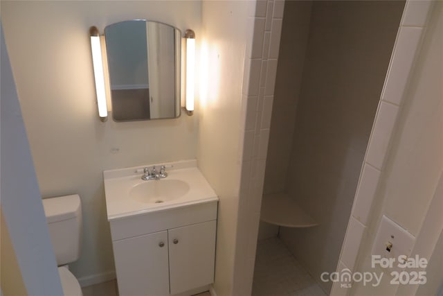 bathroom with toilet and vanity