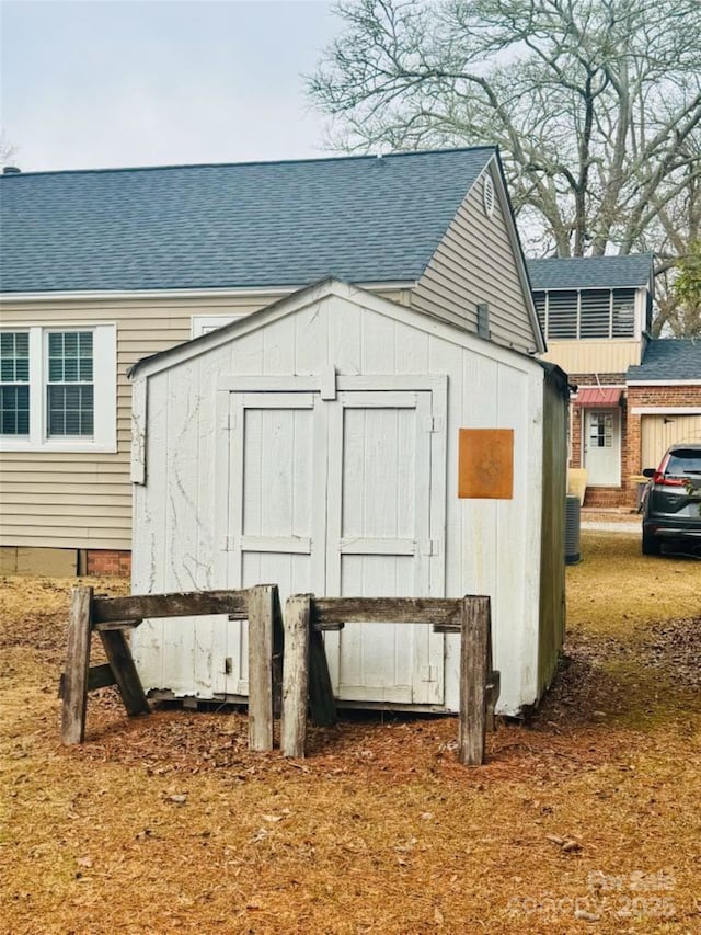 view of outdoor structure with central AC unit