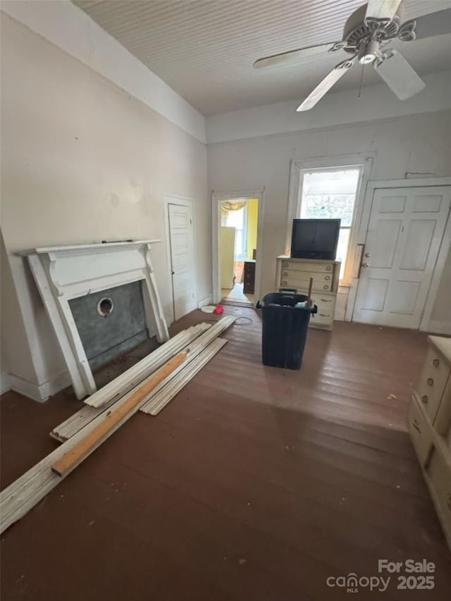 unfurnished living room with hardwood / wood-style floors and ceiling fan