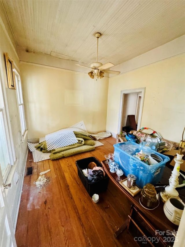 interior space with ceiling fan and hardwood / wood-style floors