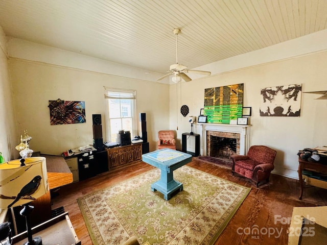 living room featuring ceiling fan and wood-type flooring