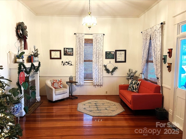 sitting room featuring dark hardwood / wood-style flooring and crown molding