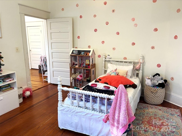 bedroom featuring dark wood-type flooring