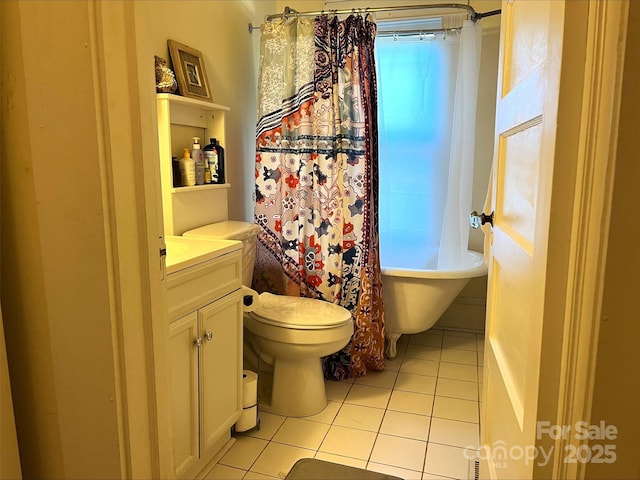 full bathroom featuring toilet, tile patterned flooring, shower / tub combo, and vanity