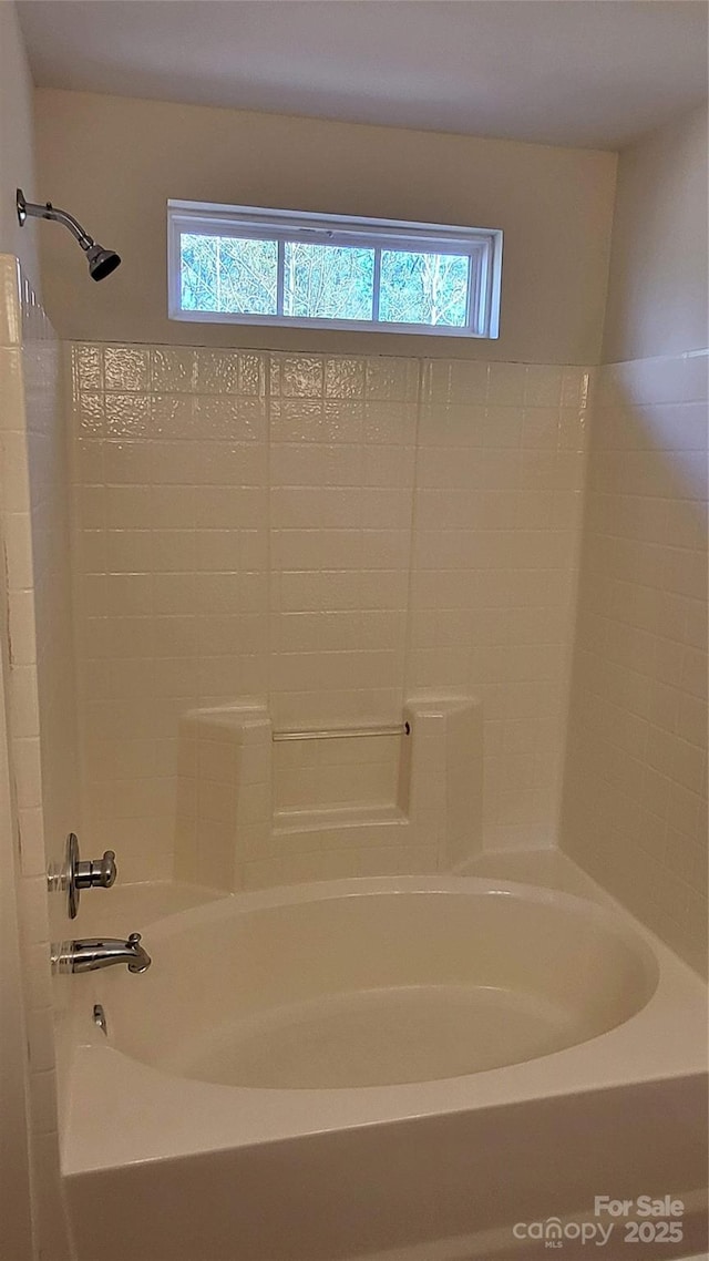 bathroom featuring  shower combination