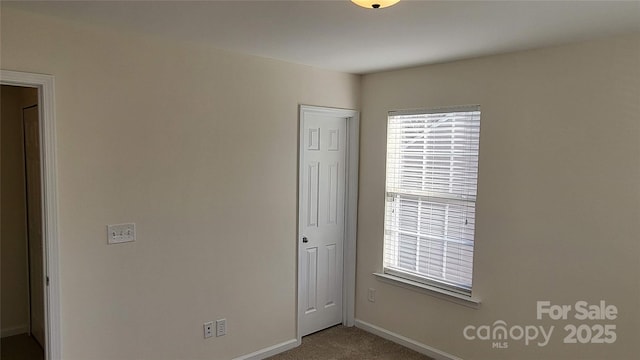 unfurnished bedroom featuring carpet flooring