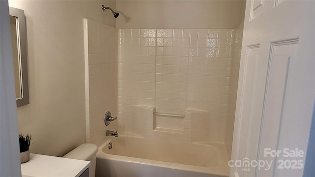 full bathroom with toilet, vanity, and shower / tub combination