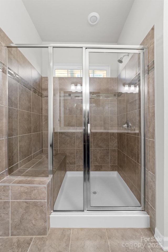 bathroom featuring tile patterned floors and walk in shower