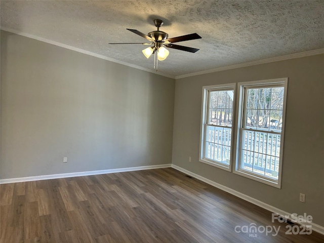 spare room with ceiling fan, crown molding, a textured ceiling, and hardwood / wood-style floors