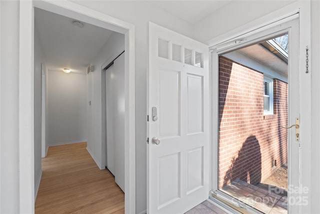 corridor featuring light wood-type flooring