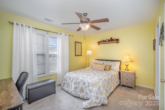 bedroom with ceiling fan and light carpet