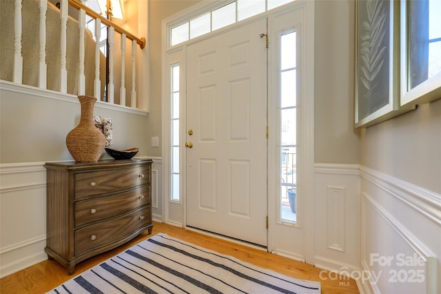 entrance foyer featuring plenty of natural light and light wood-type flooring