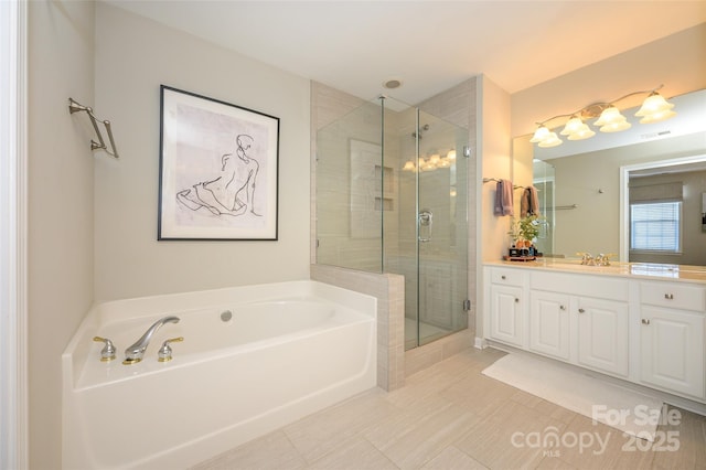 bathroom with plus walk in shower, tile patterned flooring, and vanity