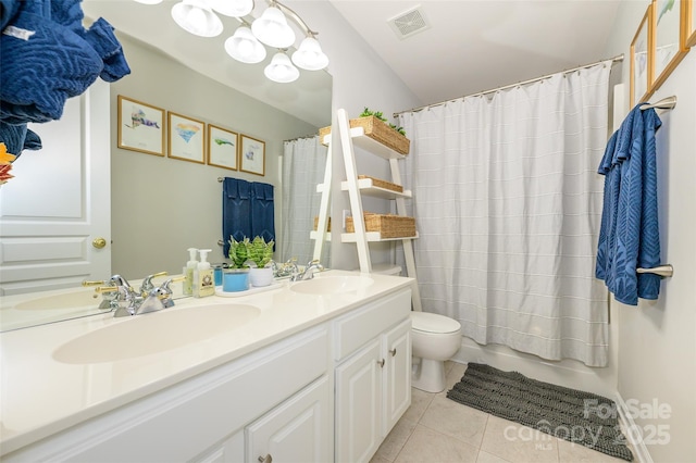 full bathroom with toilet, vanity, shower / tub combo, and tile patterned floors