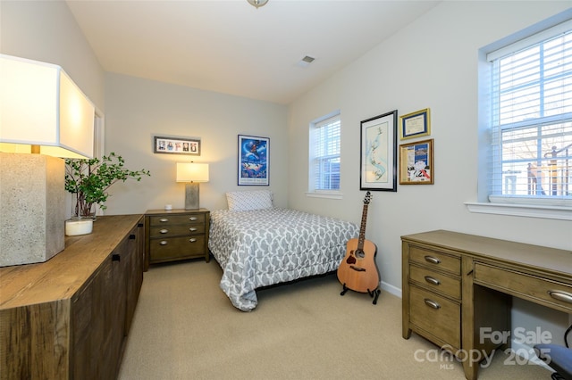 bedroom with light carpet