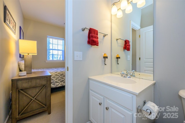 bathroom with toilet and vanity