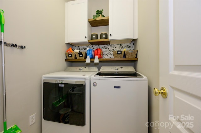 clothes washing area with cabinets and independent washer and dryer