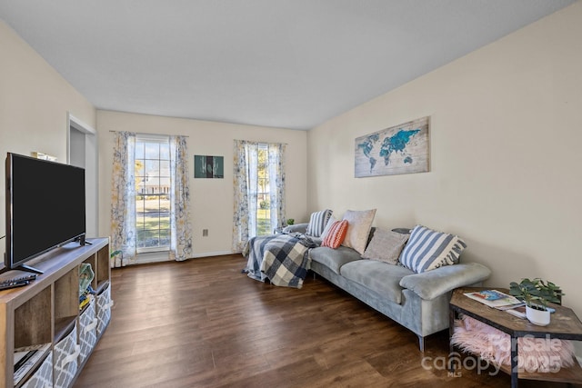 living room with dark hardwood / wood-style flooring