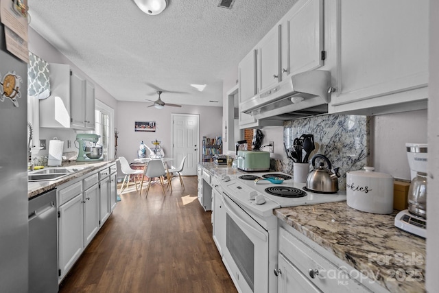 kitchen featuring ceiling fan, electric stove, a textured ceiling, stainless steel dishwasher, and white cabinets