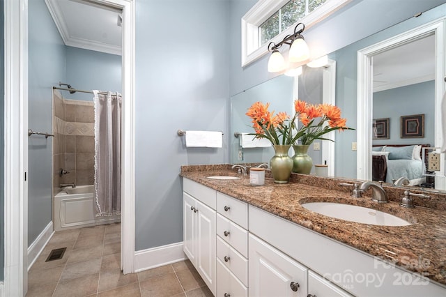 bathroom featuring ornamental molding, shower / bathtub combination with curtain, and vanity