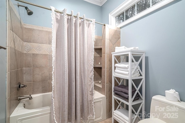 bathroom featuring toilet, shower / bath combo with shower curtain, and ornamental molding