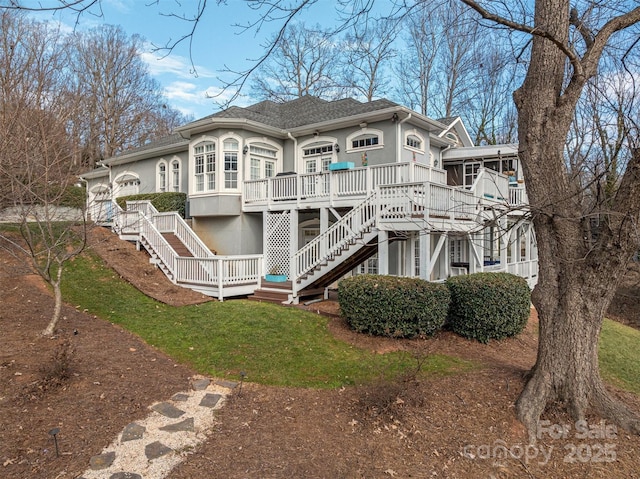 back of property featuring a deck