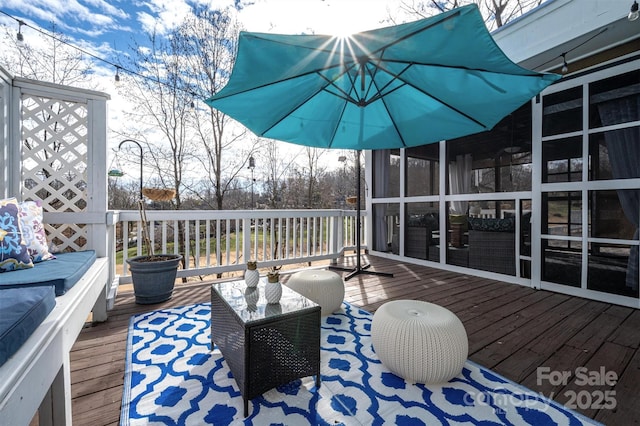 deck with a sunroom