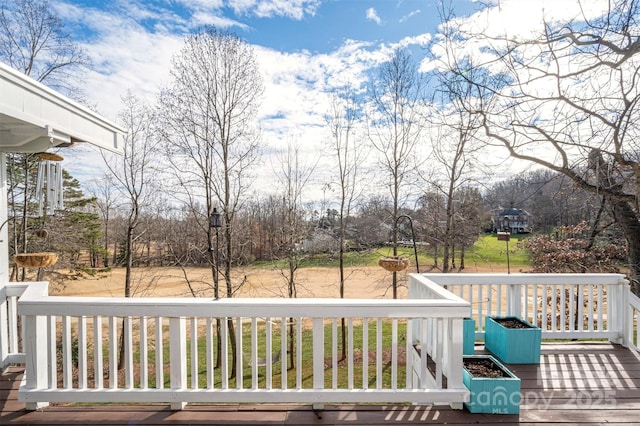 deck featuring a lawn