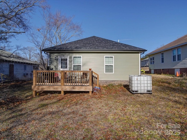 back of property featuring a deck