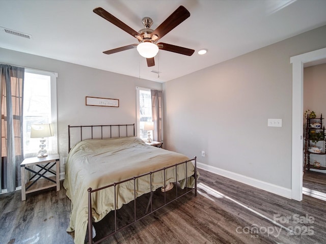 bedroom featuring dark wood-type flooring and ceiling fan