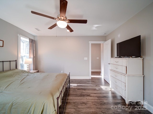 bedroom featuring ceiling fan and dark hardwood / wood-style floors