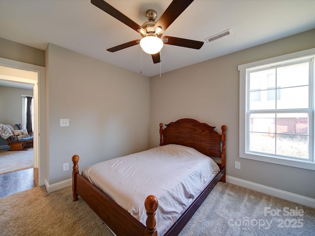 bedroom featuring ceiling fan and light colored carpet