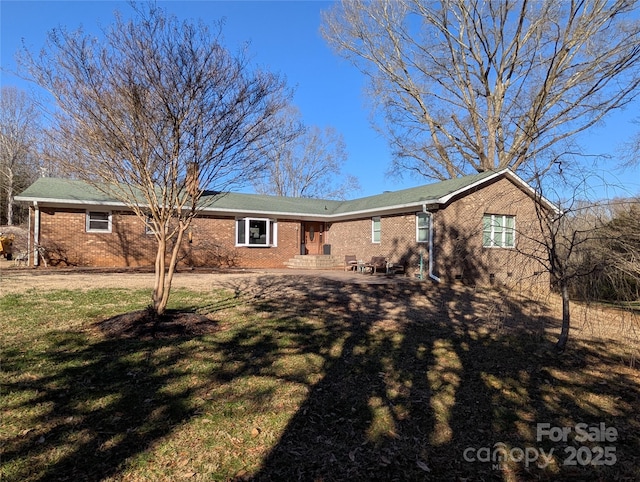 rear view of property with a yard