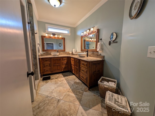 bathroom with crown molding and vanity