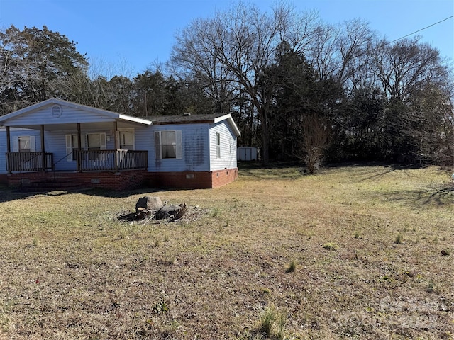 view of yard with covered porch