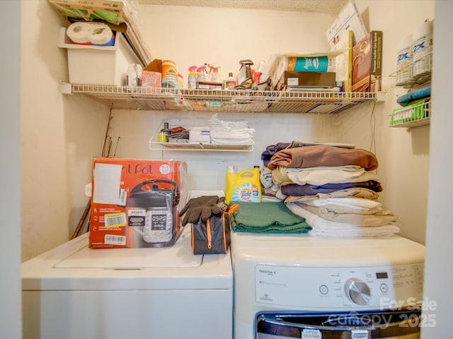 washroom featuring washer and clothes dryer