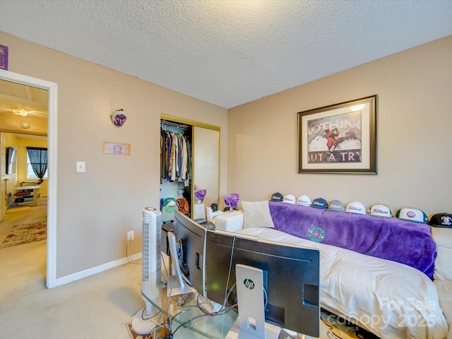 interior space featuring light colored carpet, a closet, and a textured ceiling