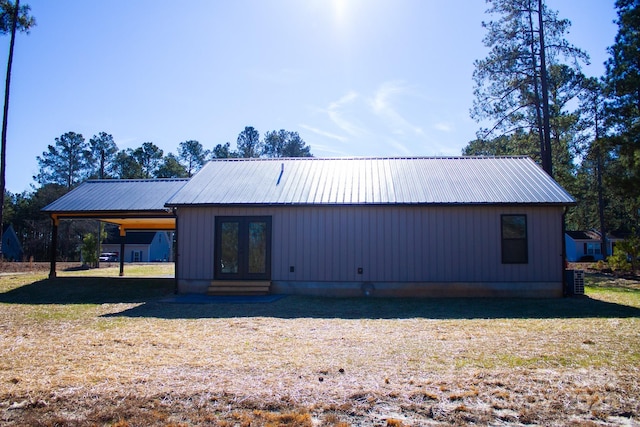 back of house featuring french doors