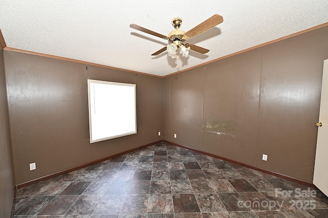 spare room with ceiling fan, a textured ceiling, and ornamental molding