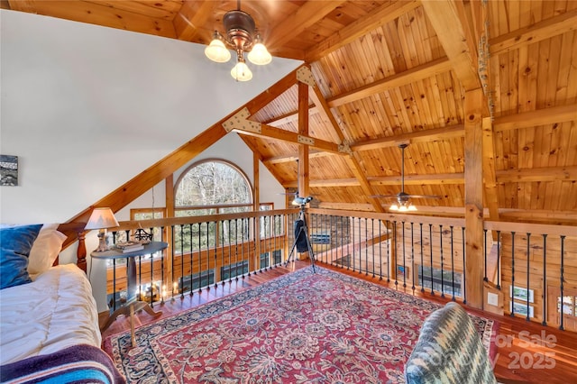 bedroom with vaulted ceiling with beams and wooden ceiling